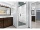 Bathroom with a walk-in shower and marble tile at 23051 Lake Lindsey Rd, Brooksville, FL 34601