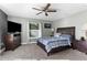 Main bedroom with a large bed and ensuite bathroom at 23051 Lake Lindsey Rd, Brooksville, FL 34601