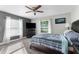 Main bedroom with large bed and ceiling fan at 23051 Lake Lindsey Rd, Brooksville, FL 34601