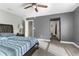 Bedroom with a large bed and ensuite bathroom at 23051 Lake Lindsey Rd, Brooksville, FL 34601