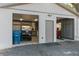 Two-car garage with golf cart, tools, and storage cabinets at 23051 Lake Lindsey Rd, Brooksville, FL 34601