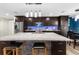 Modern kitchen with large island and granite countertops at 23051 Lake Lindsey Rd, Brooksville, FL 34601