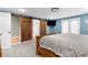 Bedroom with barn doors leading to bathroom and closet at 23051 Lake Lindsey Rd, Brooksville, FL 34601