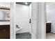 Walk-in shower with tile surround and built-in seat at 23051 Lake Lindsey Rd, Brooksville, FL 34601