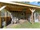 Outdoor storage shed with gardening tools and lawnmower at 23051 Lake Lindsey Rd, Brooksville, FL 34601