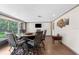 Sunroom with a round table and chairs, offering views of the backyard at 23051 Lake Lindsey Rd, Brooksville, FL 34601