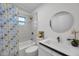 Modern bathroom with a tub, shower, and updated vanity at 2643 Narcissus Dr, Holiday, FL 34691