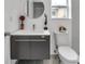 Contemporary bathroom featuring a floating vanity and a toilet at 2643 Narcissus Dr, Holiday, FL 34691