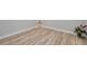 Simple bedroom with wood-look floors and a corner view at 2643 Narcissus Dr, Holiday, FL 34691