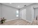 Bright bedroom with wood-look floors and a window at 2643 Narcissus Dr, Holiday, FL 34691