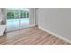 Bright dining area with wood-look floors and pool access at 2643 Narcissus Dr, Holiday, FL 34691