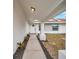 Inviting entryway with covered walkway and fresh landscaping at 2643 Narcissus Dr, Holiday, FL 34691