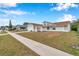 Newly renovated home with gray and white exterior, and a two-car garage at 2643 Narcissus Dr, Holiday, FL 34691
