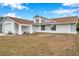 Updated home exterior with new paint, landscaping, and a two-car garage at 2643 Narcissus Dr, Holiday, FL 34691