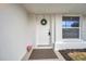 Charming front door entry with a stylish wreath at 2643 Narcissus Dr, Holiday, FL 34691