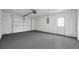 Spacious garage with epoxy floor and ample storage at 2643 Narcissus Dr, Holiday, FL 34691