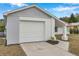Newly painted two-car garage with a fresh, modern look at 2643 Narcissus Dr, Holiday, FL 34691