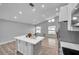 Open concept kitchen with island and living room view at 2643 Narcissus Dr, Holiday, FL 34691