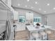 Renovated kitchen, featuring white cabinets and an island at 2643 Narcissus Dr, Holiday, FL 34691