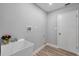 Convenient laundry room with utility sink and storage at 2643 Narcissus Dr, Holiday, FL 34691