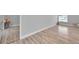 Spacious living room with wood-look floors and natural light at 2643 Narcissus Dr, Holiday, FL 34691