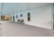 Large covered patio with grey flooring and plenty of seating at 2643 Narcissus Dr, Holiday, FL 34691