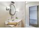 Bathroom with vanity, sink, and mirror at 2700 Bayshore Blvd # 3108, Dunedin, FL 34698