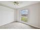 Bright bedroom with large window and ceiling fan at 2700 Bayshore Blvd # 3108, Dunedin, FL 34698