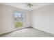 Spacious bedroom with window and carpeting at 2700 Bayshore Blvd # 3108, Dunedin, FL 34698