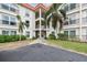 Mediterranean Manors condo building with red tile roofs and lush landscaping at 2700 Bayshore Blvd # 3108, Dunedin, FL 34698