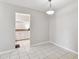 Bright dining room with tile floors and access to kitchen at 2700 Bayshore Blvd # 3108, Dunedin, FL 34698