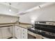 Modern kitchen with stainless steel appliances and white cabinets at 2700 Bayshore Blvd # 3108, Dunedin, FL 34698