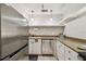 Updated kitchen with stainless steel appliances and white cabinets at 2700 Bayshore Blvd # 3108, Dunedin, FL 34698