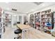 Community library with bookshelves and work tables at 2700 Bayshore Blvd # 3108, Dunedin, FL 34698