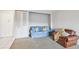 Living area with seating and built-in shelving at 2700 Bayshore Blvd # 3108, Dunedin, FL 34698