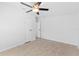 Well-lit bedroom with ceiling fan and laminate flooring at 39705 Sunburst Dr, Dade City, FL 33525