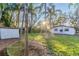 Spacious backyard with lush landscaping and shed at 405 Pine S Ave, Oldsmar, FL 34677