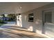 Covered patio with access to backyard and additional parking at 405 Pine S Ave, Oldsmar, FL 34677