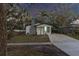 Updated home with stone chimney and landscaped yard at 405 Pine S Ave, Oldsmar, FL 34677