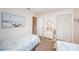 Guest bedroom with twin beds and light décor at 4426 Pelorus Dr # 4426, New Port Richey, FL 34652