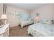 Guest bedroom with twin beds and light décor at 4426 Pelorus Dr # 4426, New Port Richey, FL 34652