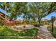 Community courtyard with fountain, benches, and lush landscaping at 4426 Pelorus Dr # 4426, New Port Richey, FL 34652