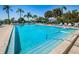 Refreshing community pool with surrounding lounge chairs at 4426 Pelorus Dr # 4426, New Port Richey, FL 34652