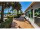 Relaxing community pool area with patio furniture and clubhouse at 4426 Pelorus Dr # 4426, New Port Richey, FL 34652