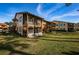 Condo building with grassy area and screened lanais at 4426 Pelorus Dr # 4426, New Port Richey, FL 34652
