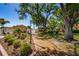 Landscaped walkway with trees and gate at 4426 Pelorus Dr # 4426, New Port Richey, FL 34652