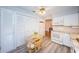 Kitchen boasts white cabinets, granite counters, and a breakfast nook at 4426 Pelorus Dr # 4426, New Port Richey, FL 34652