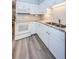 Kitchen with granite countertops and white cabinets at 4426 Pelorus Dr # 4426, New Port Richey, FL 34652