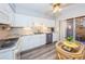 Kitchen with granite countertops, white cabinets, and a view to the patio at 4426 Pelorus Dr # 4426, New Port Richey, FL 34652