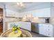 Bright kitchen with granite countertops, white cabinets, and stainless steel appliances at 4426 Pelorus Dr # 4426, New Port Richey, FL 34652